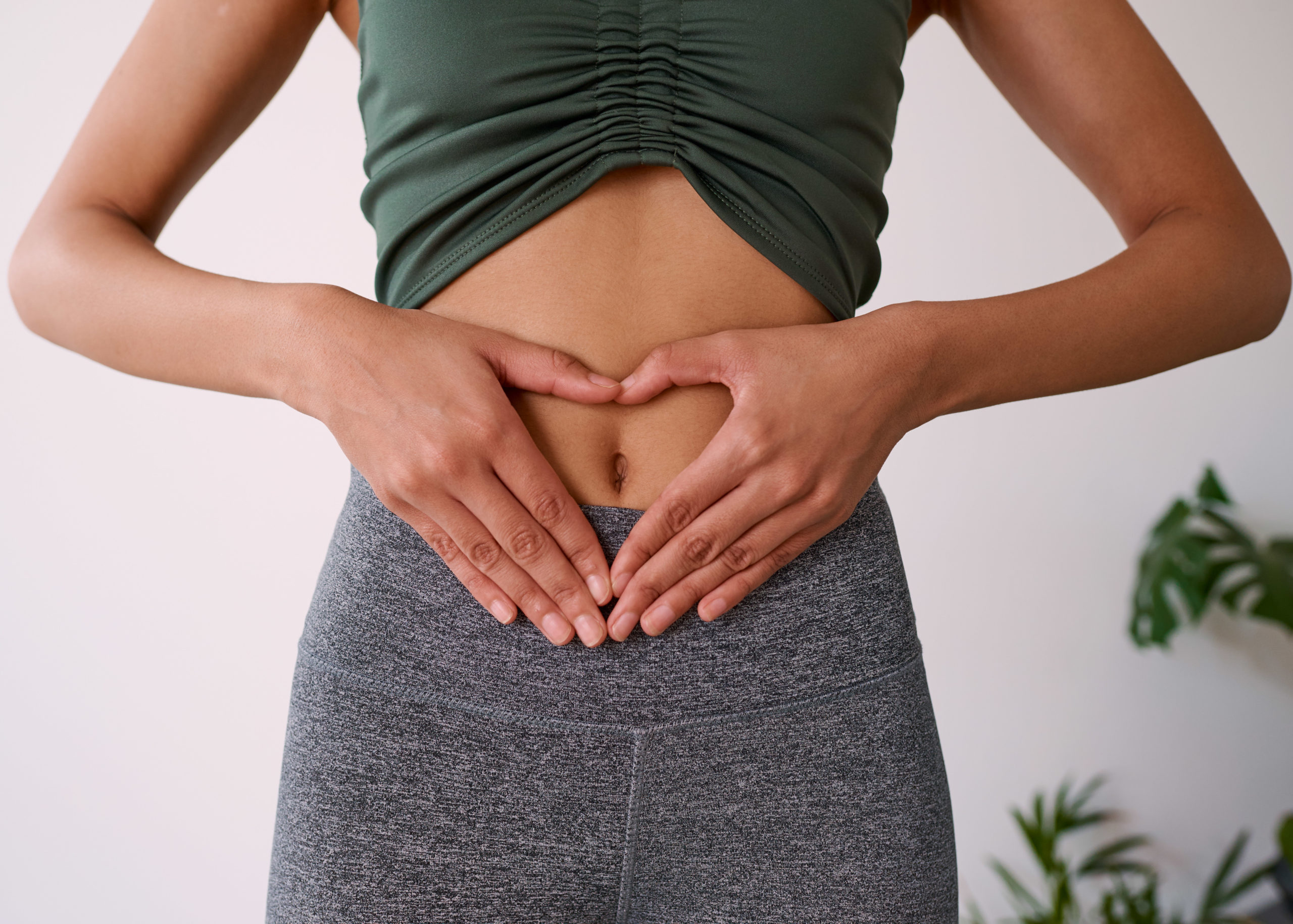 Close up of a woman's hands on her stomach