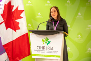 Dr. Nicole Racine speaking at CIHR MHITEY funding announcement