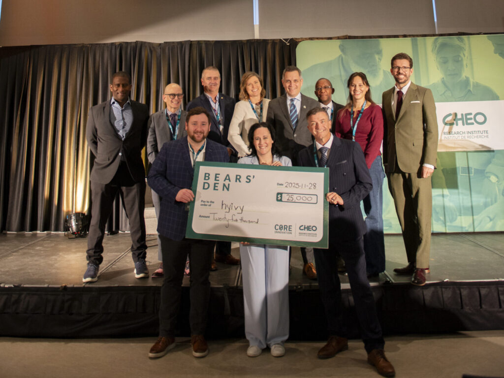Rachel Bartholomew of Hyivy receiving winner's cheque at 2025 CHEO Bears' Den